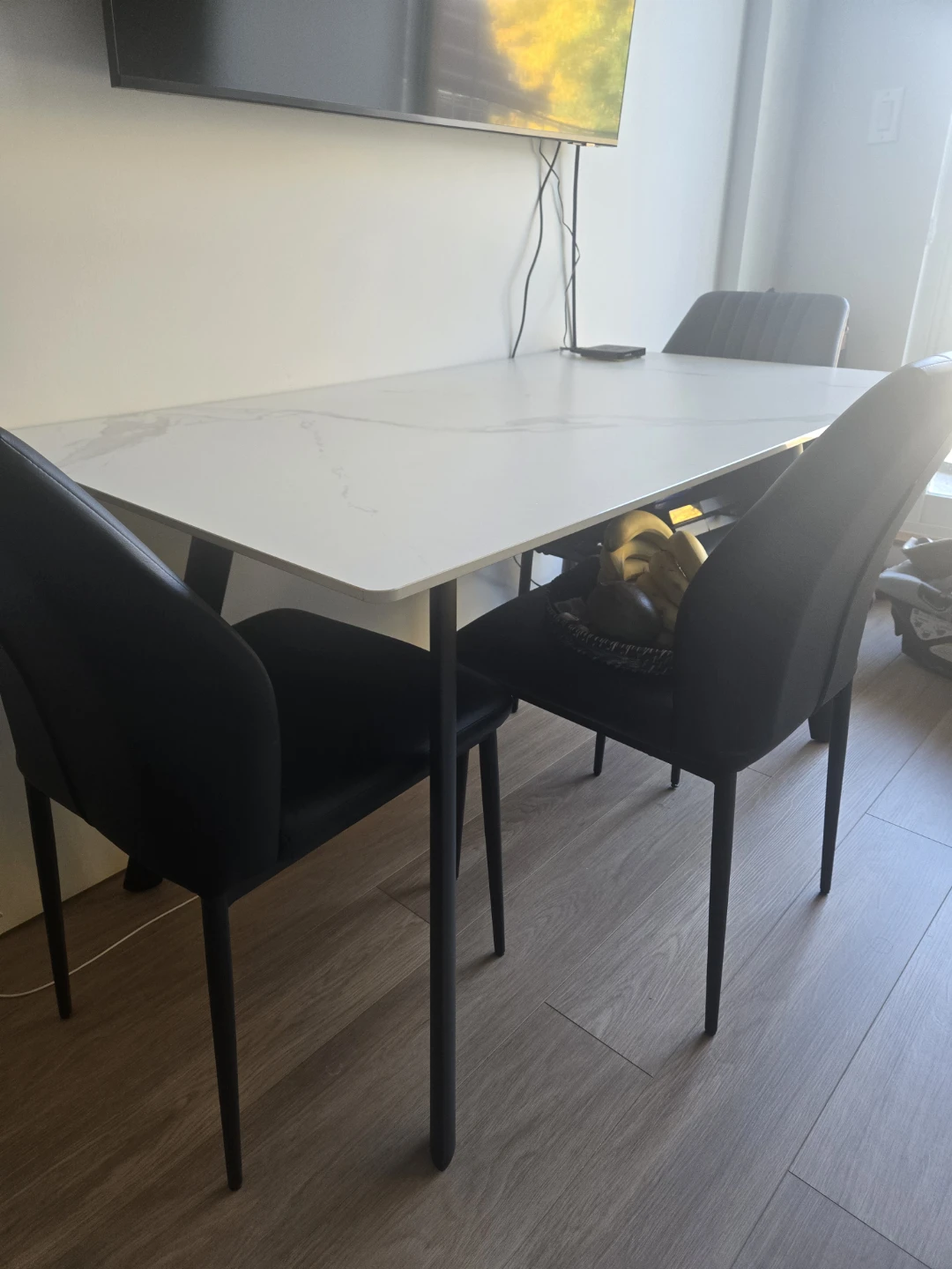 Modern White Marble-Look Table and Black Chairs Set