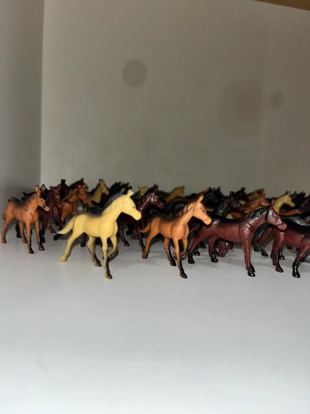 Large collection of plastic toy horses