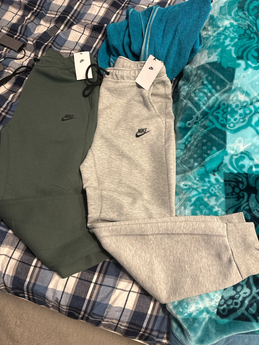 Two pairs of Nike Tech Fleece joggers, size Medium