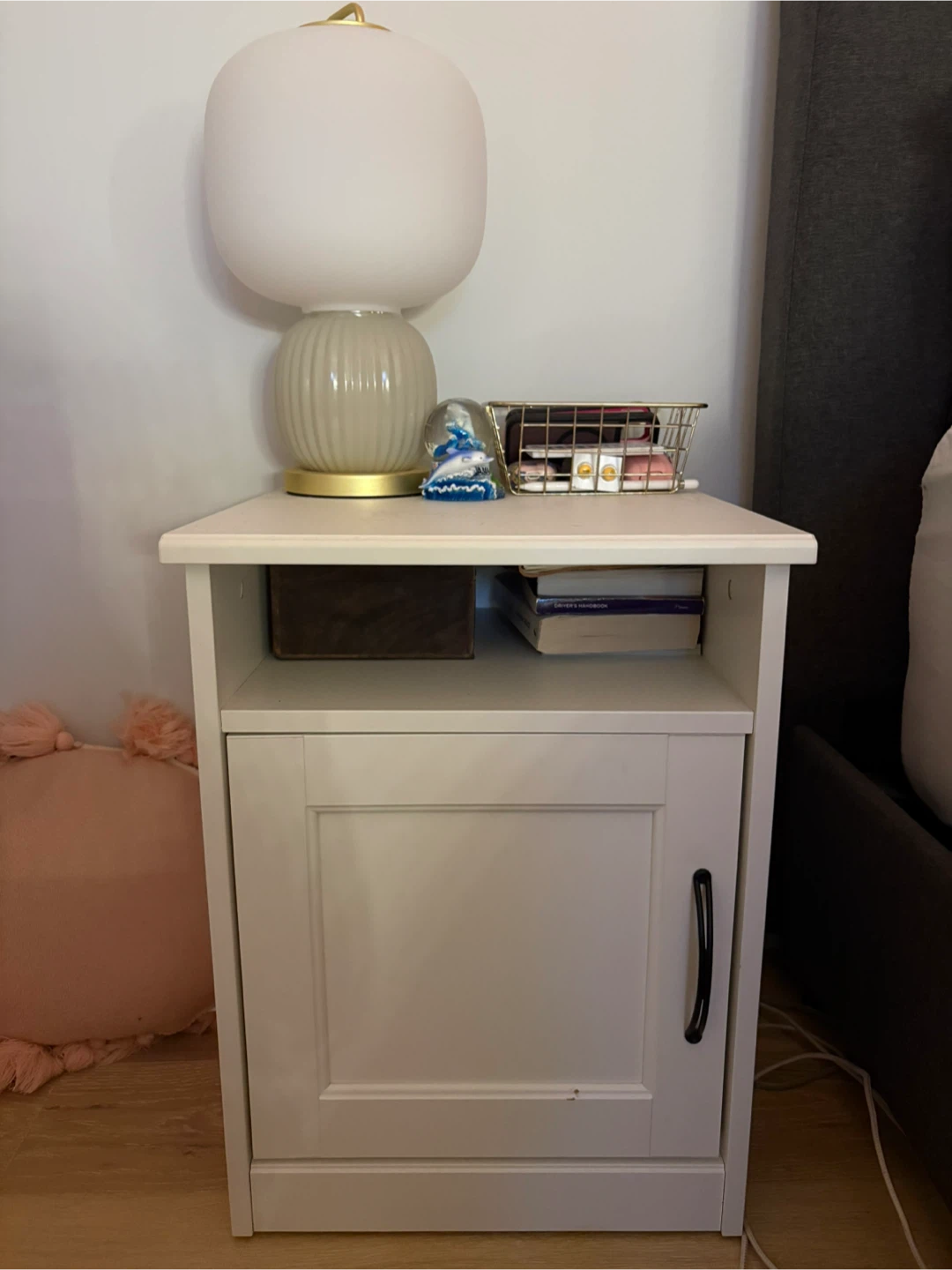 2 white nightstands with black hardware
