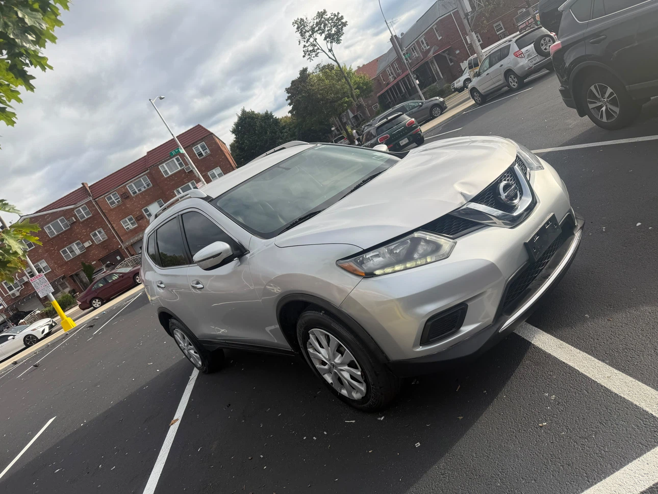 Silver Nissan Rogue SUV - photo 2