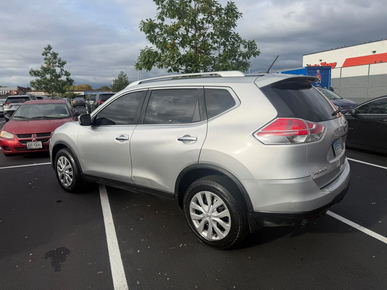 Silver Nissan Rogue SUV - photo 3