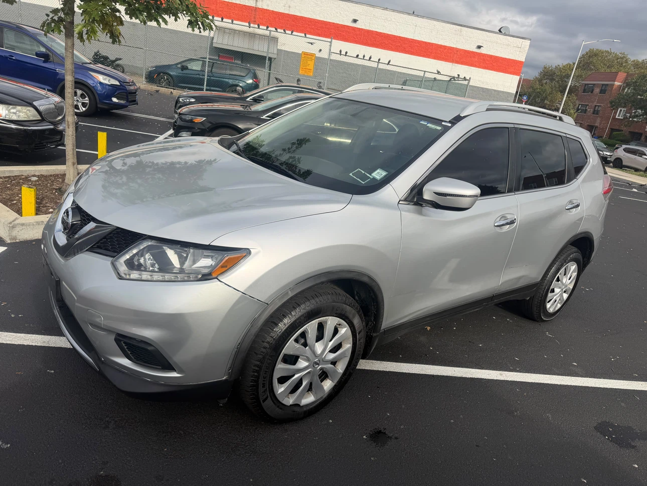 Silver Nissan Rogue SUV - photo 4
