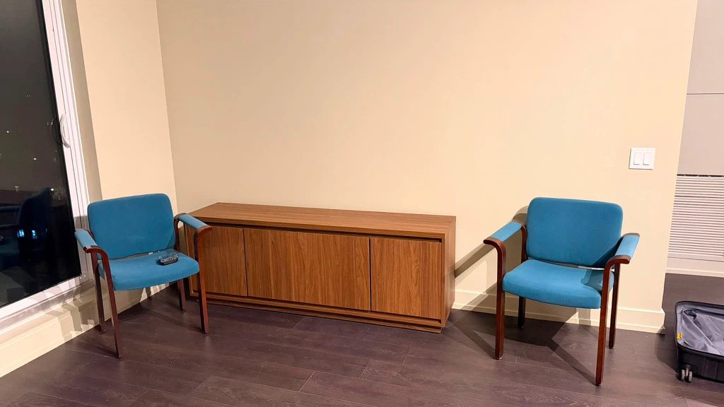 Two Teal Fabric Armchairs with Wood Frames