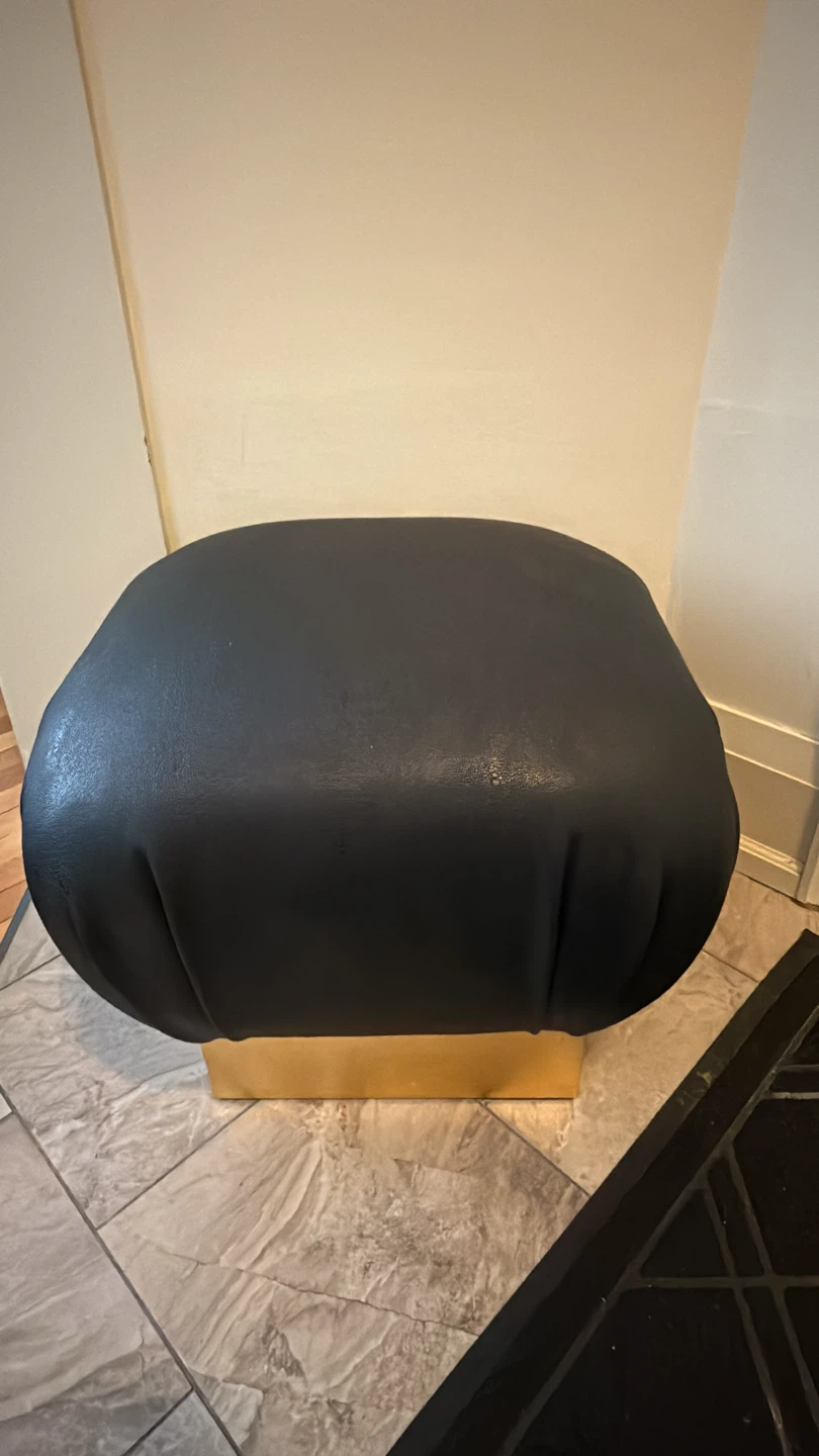 Modern black leather ottoman with Gold Base