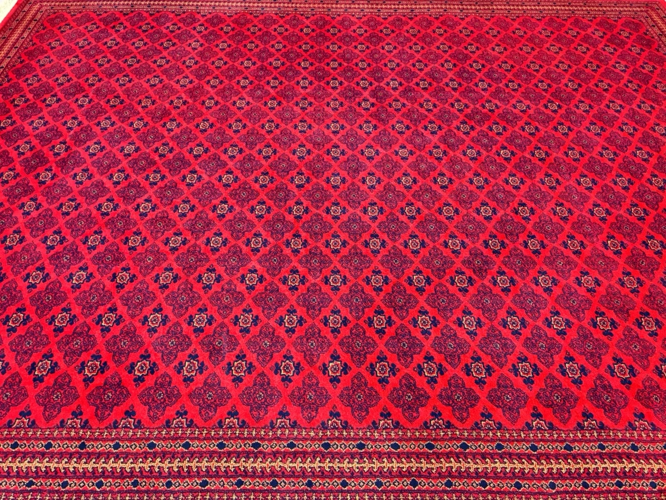 Traditional Afghan red patterned rugs (x4)