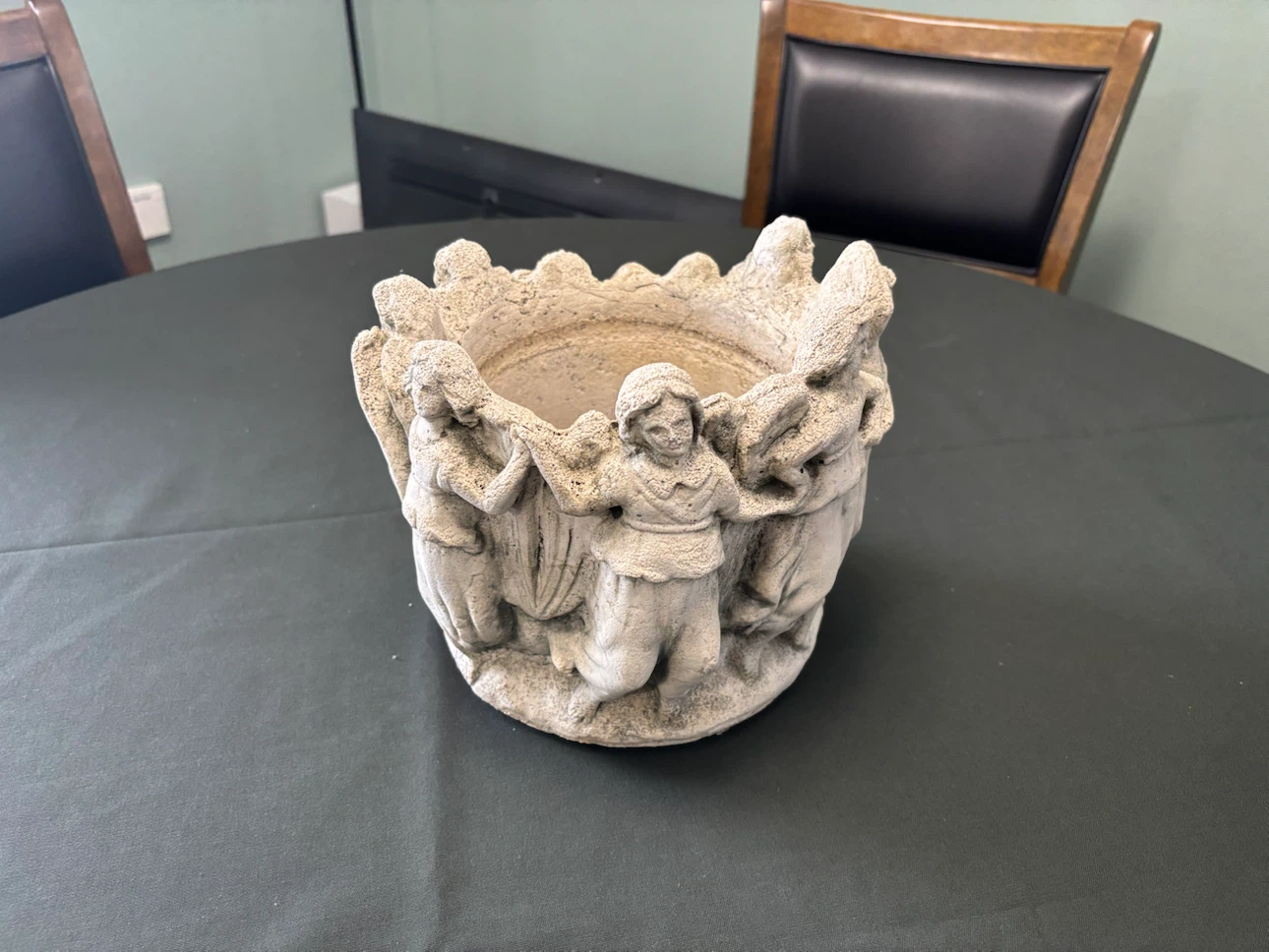 Stone effect decorative planter with figures