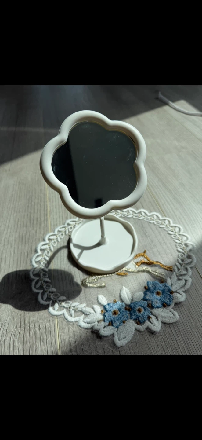 White flower-shaped tabletop mirror