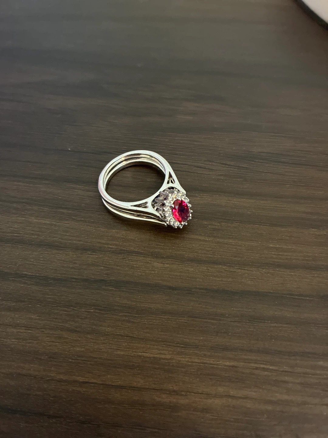 Double finger ring with blue and red stones