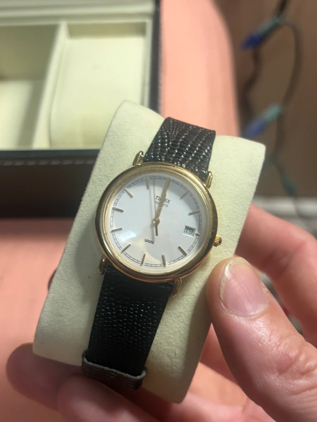 Classic gold-tone Timex watch with black leather strap