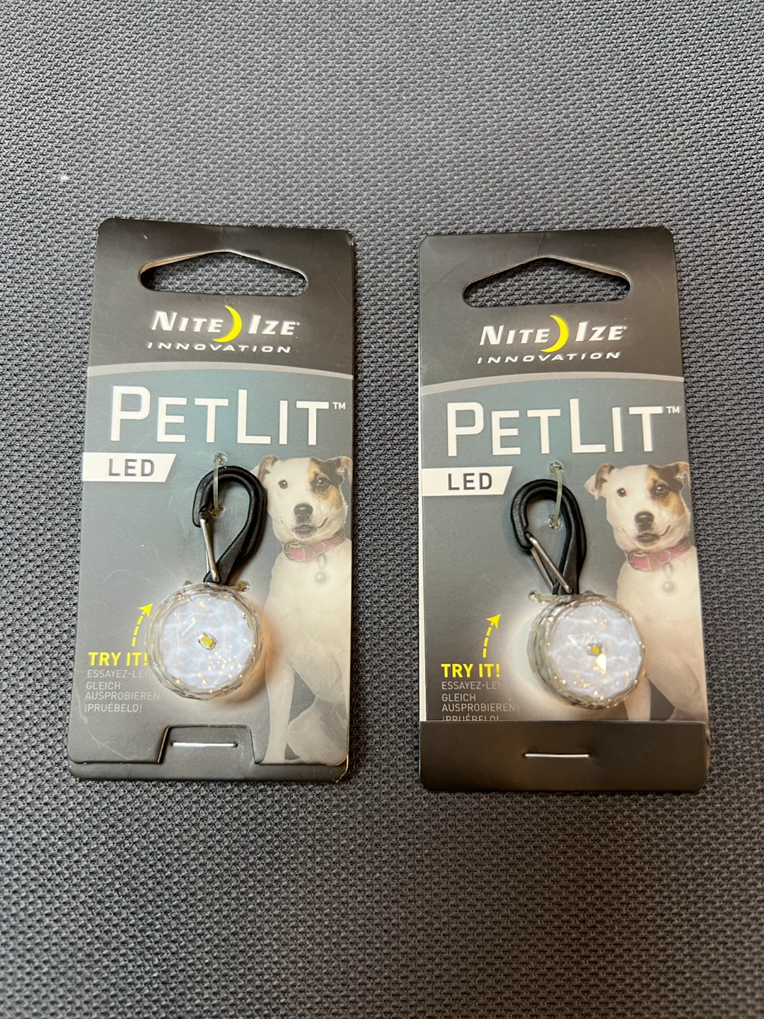 Two Nite Ize PetLit LED collar lights