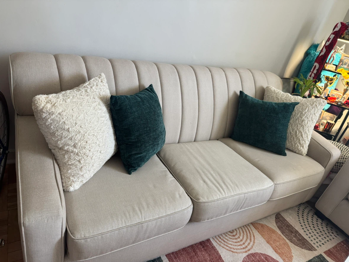 Beige Upholstered Three-Seater Sofa