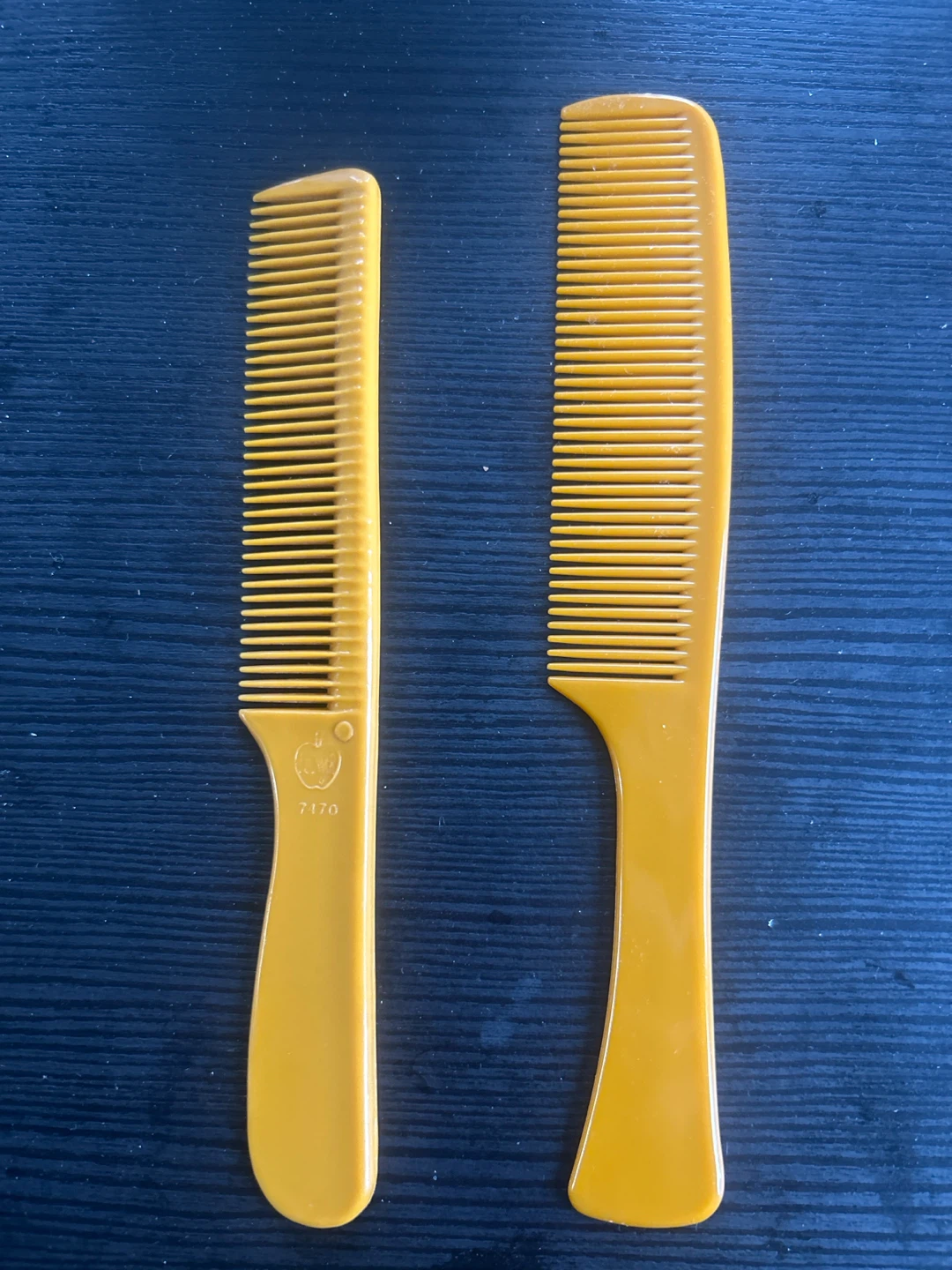 Two Vintage Yellow Combs