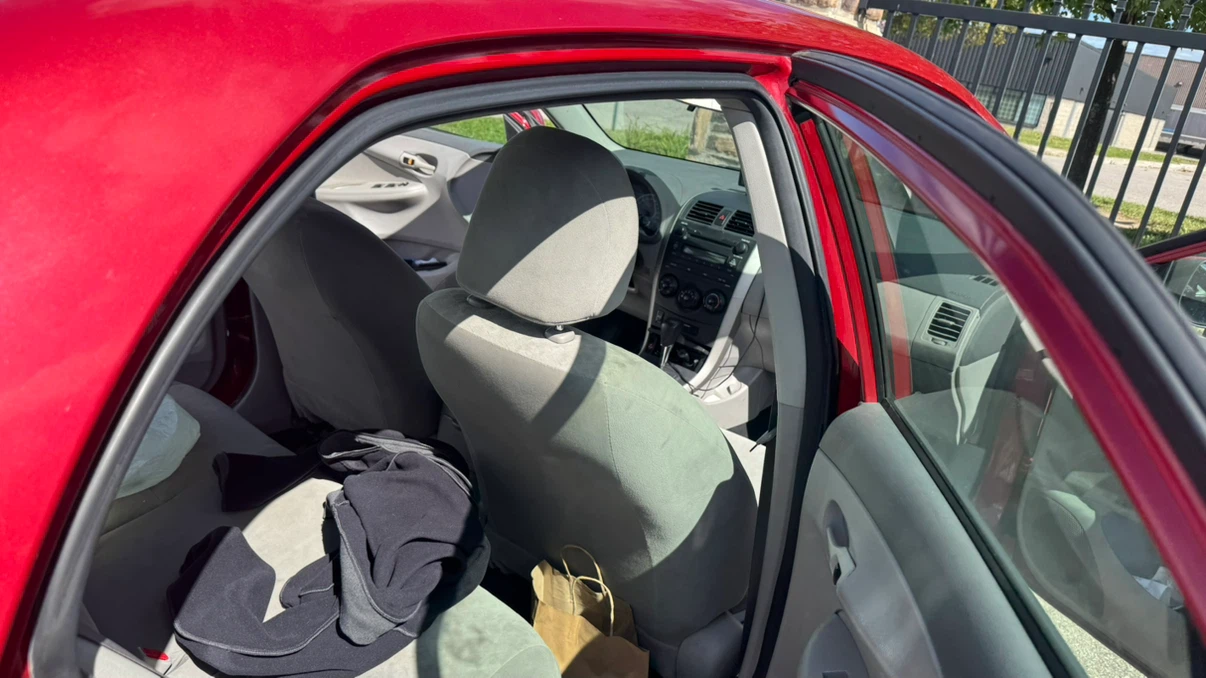 Red Toyota Corolla CE