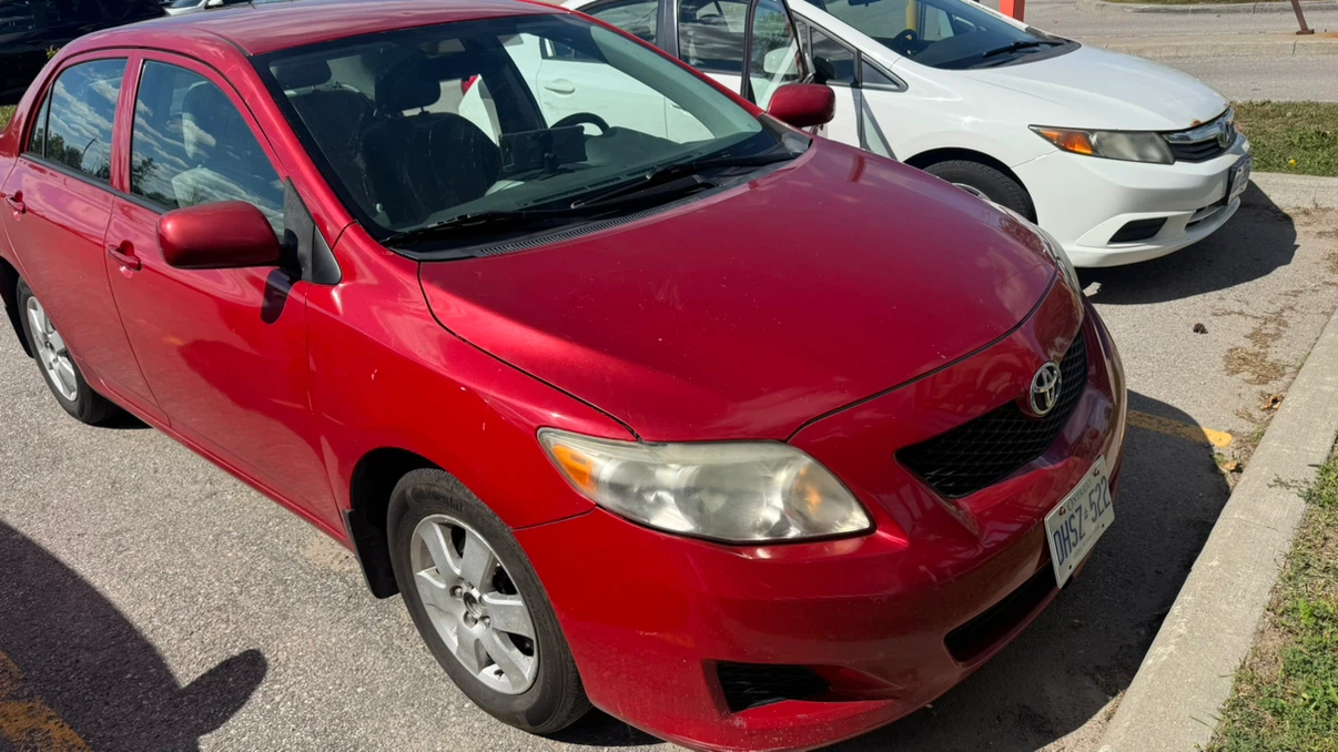 Red Toyota Corolla CE - photo 3
