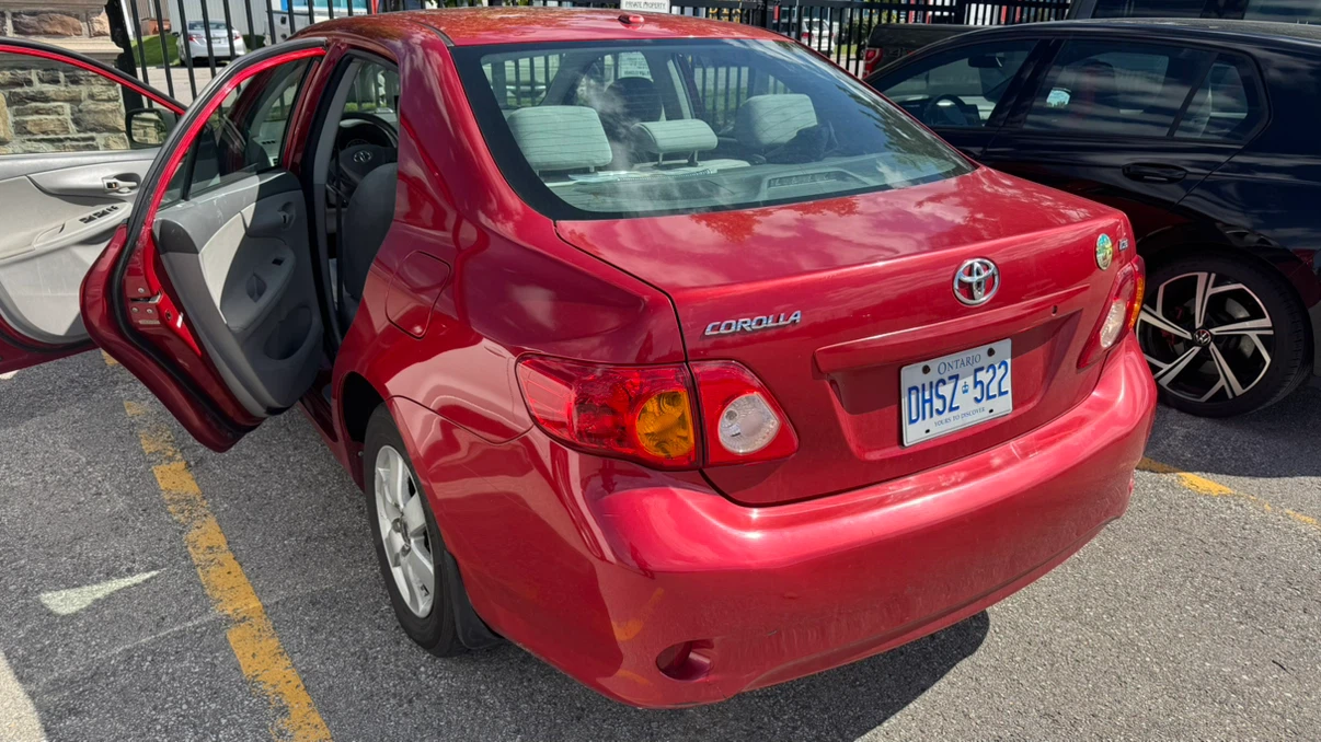 Red Toyota Corolla CE - photo 4