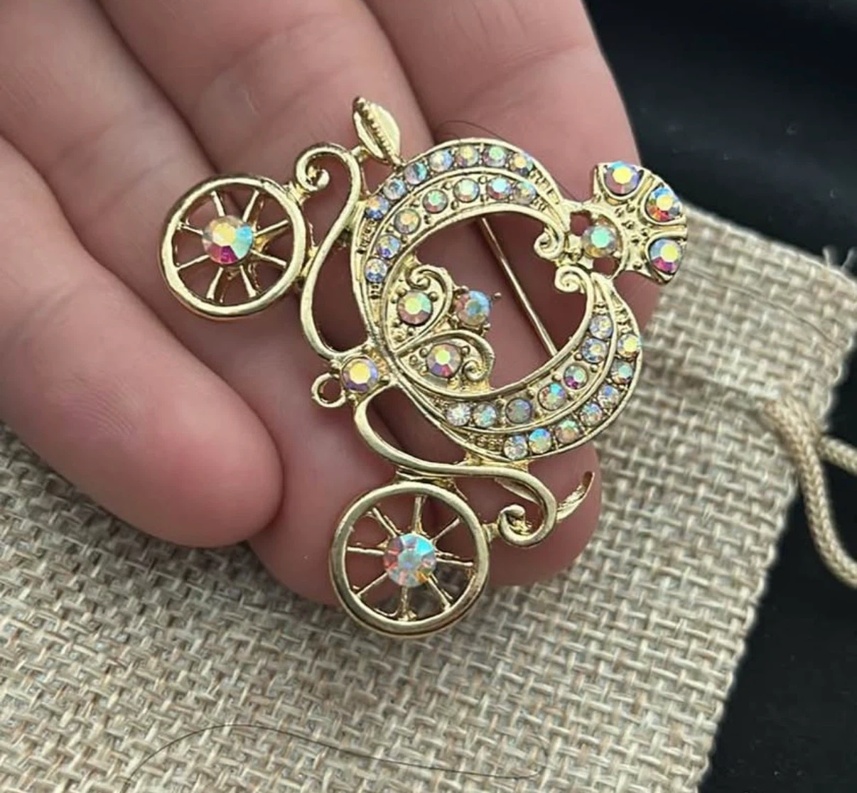 Gold-tone carriage brooch with rhinestones