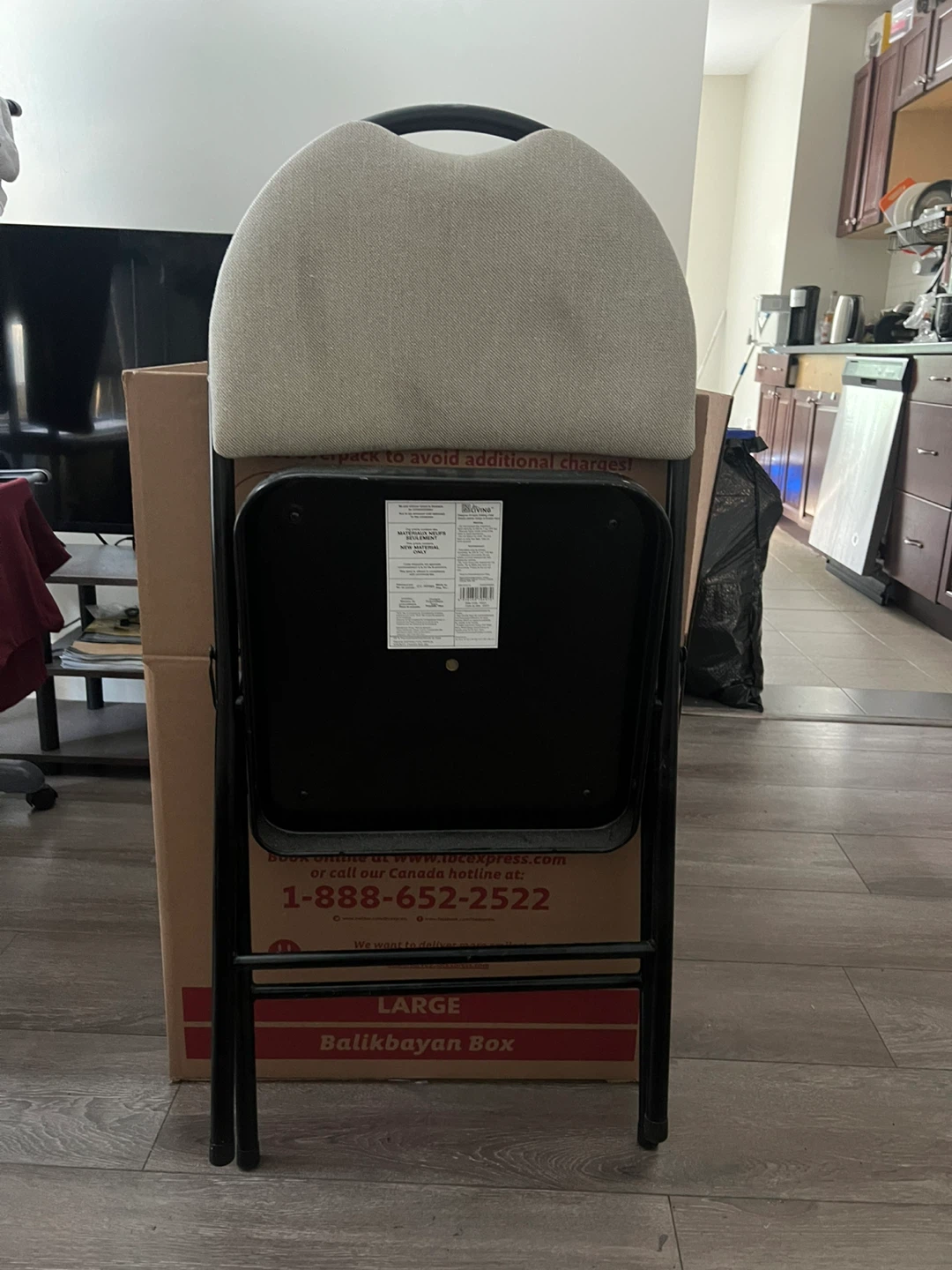 Black Folding Chair with Beige Padded Seat (used) - photo 2