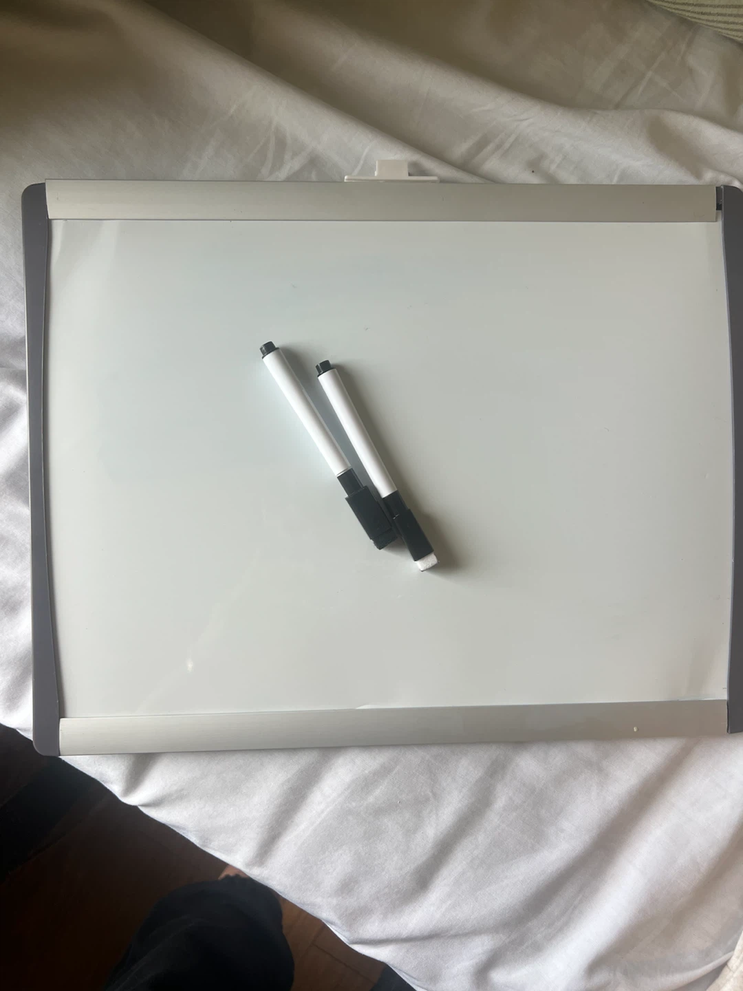 Whiteboard with two markers