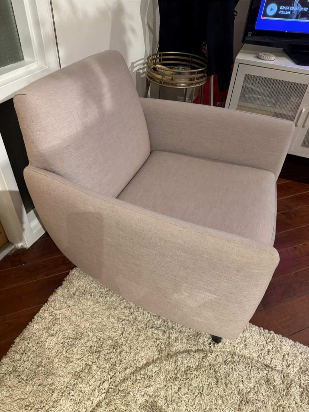 Blush pink upholstered armchair