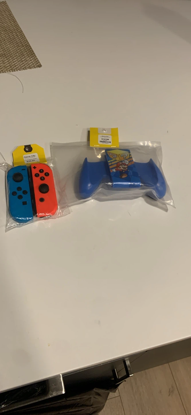 Nintendo Switch Joy-Cons and Mario Grip