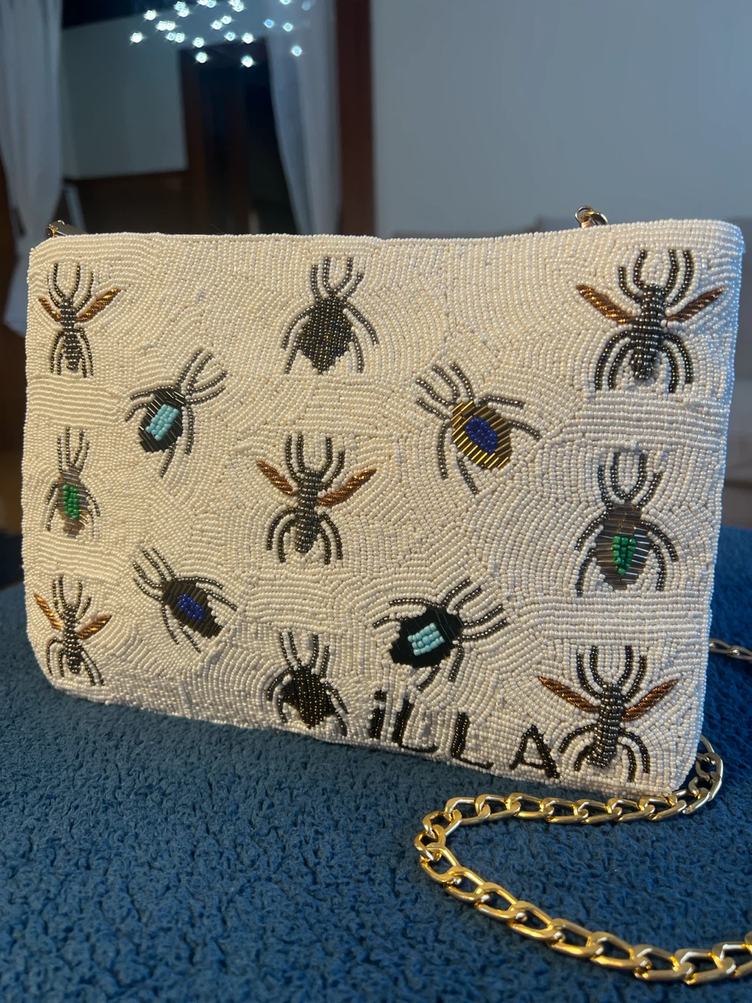 Beaded clutch with insect design