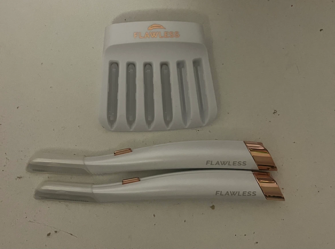 Two Finishing Touch Flawless Dermaplane Glo Tools