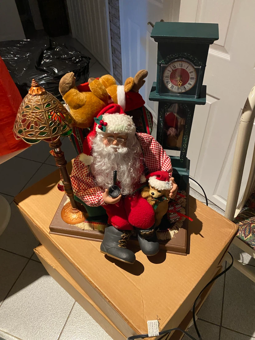 Holiday Creations Animated Santa with Puppy and Clock