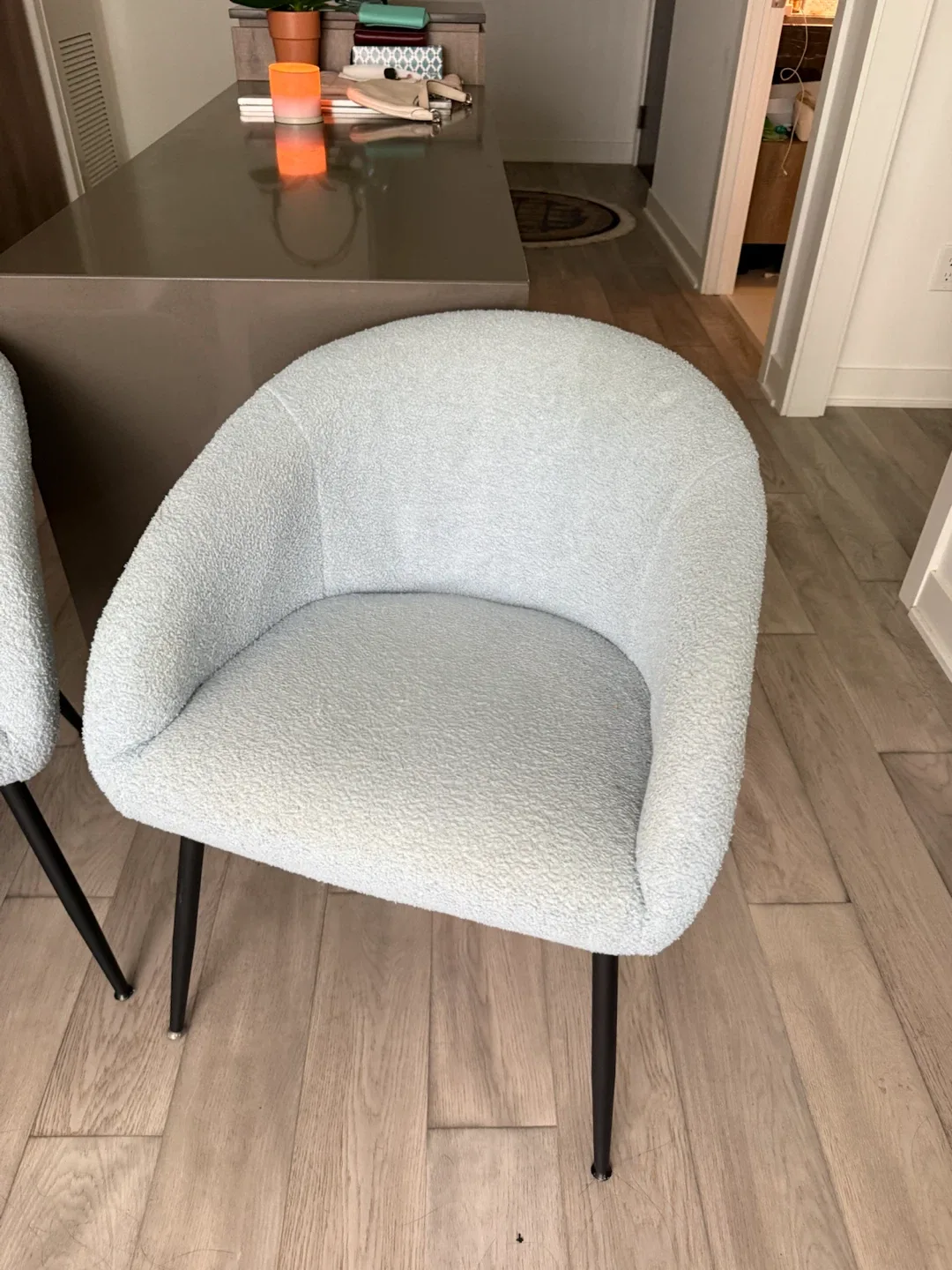 Set of two light blue bouclé dining chairs