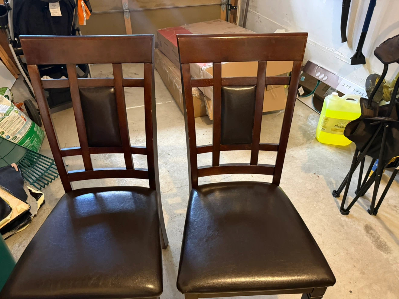 Two dark wood dining chairs with faux leather seats - photo 2