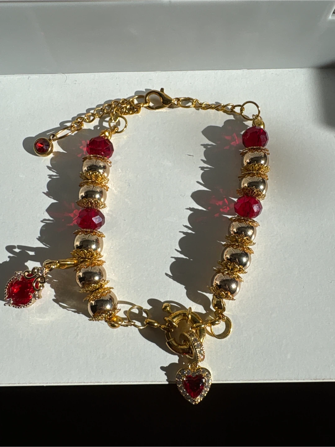 Gold-Tone Beaded Bracelet with Red Charms