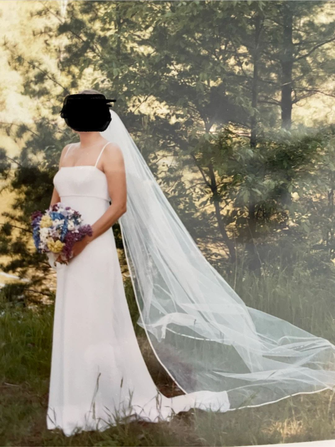 Minimalist white wedding dress with matching veil
