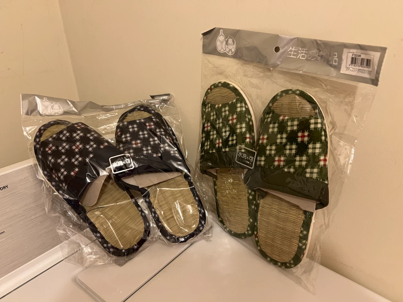 Two pairs of woven straw slippers