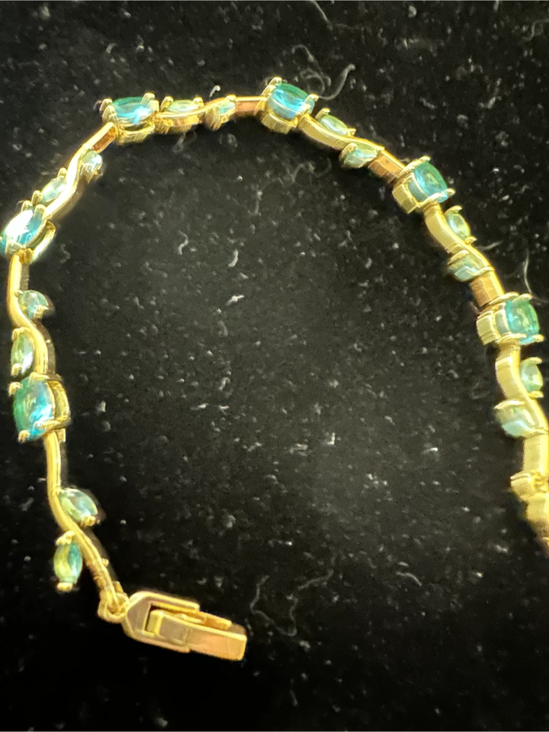 14k laminated Gold-tone bracelet with green leaf-shaped stones