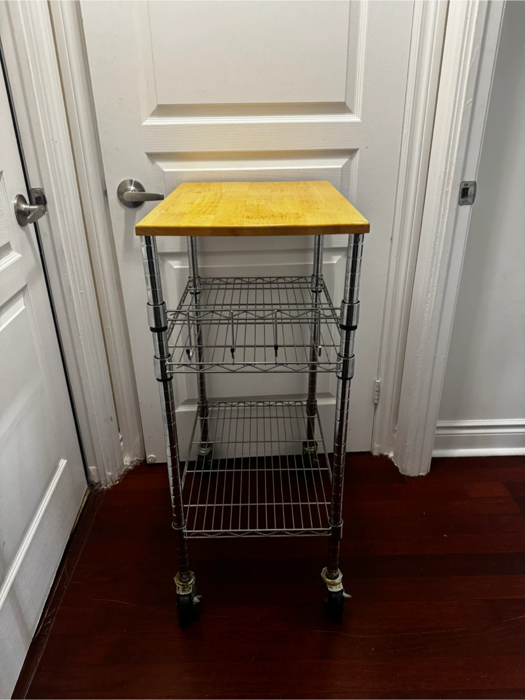 3-tier rolling wire kitchen cart with a wooden tabletop.