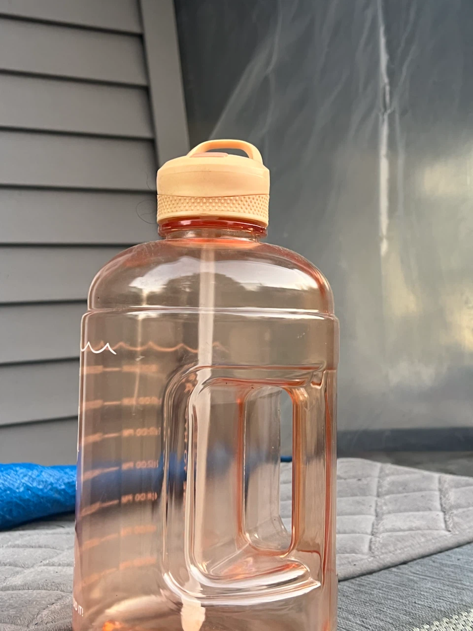 Large motivational water bottle with straw