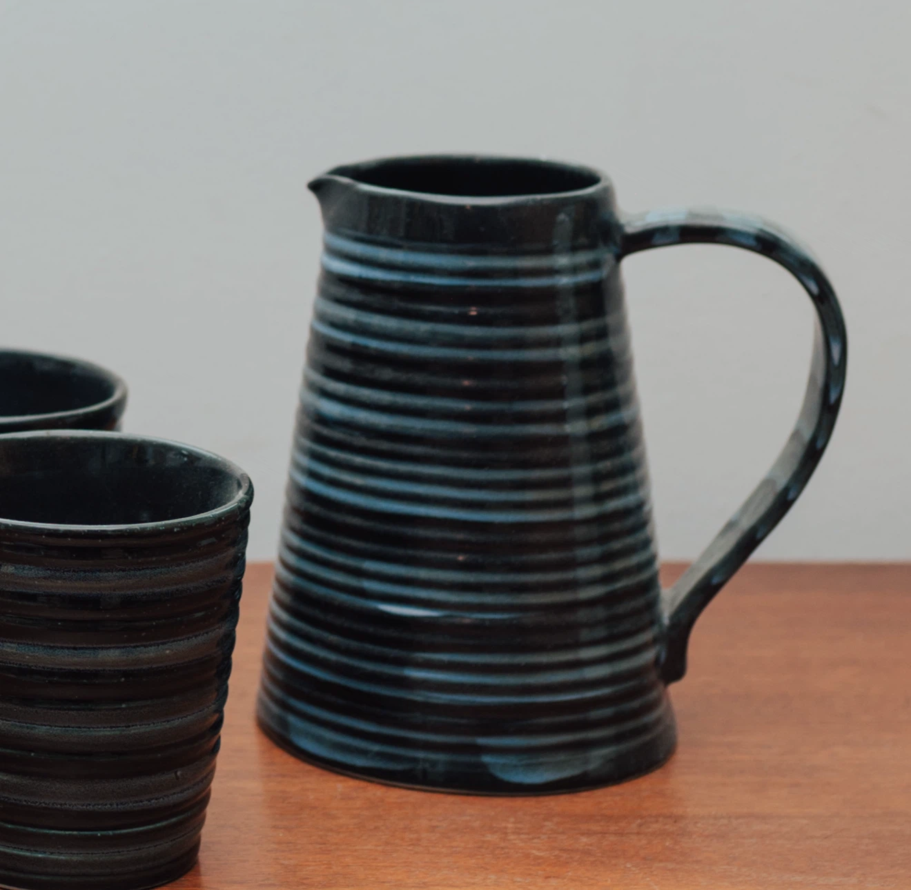 Handmade Ribbed Black Glaze Pottery Pitcher & 6 Cups - photo 3