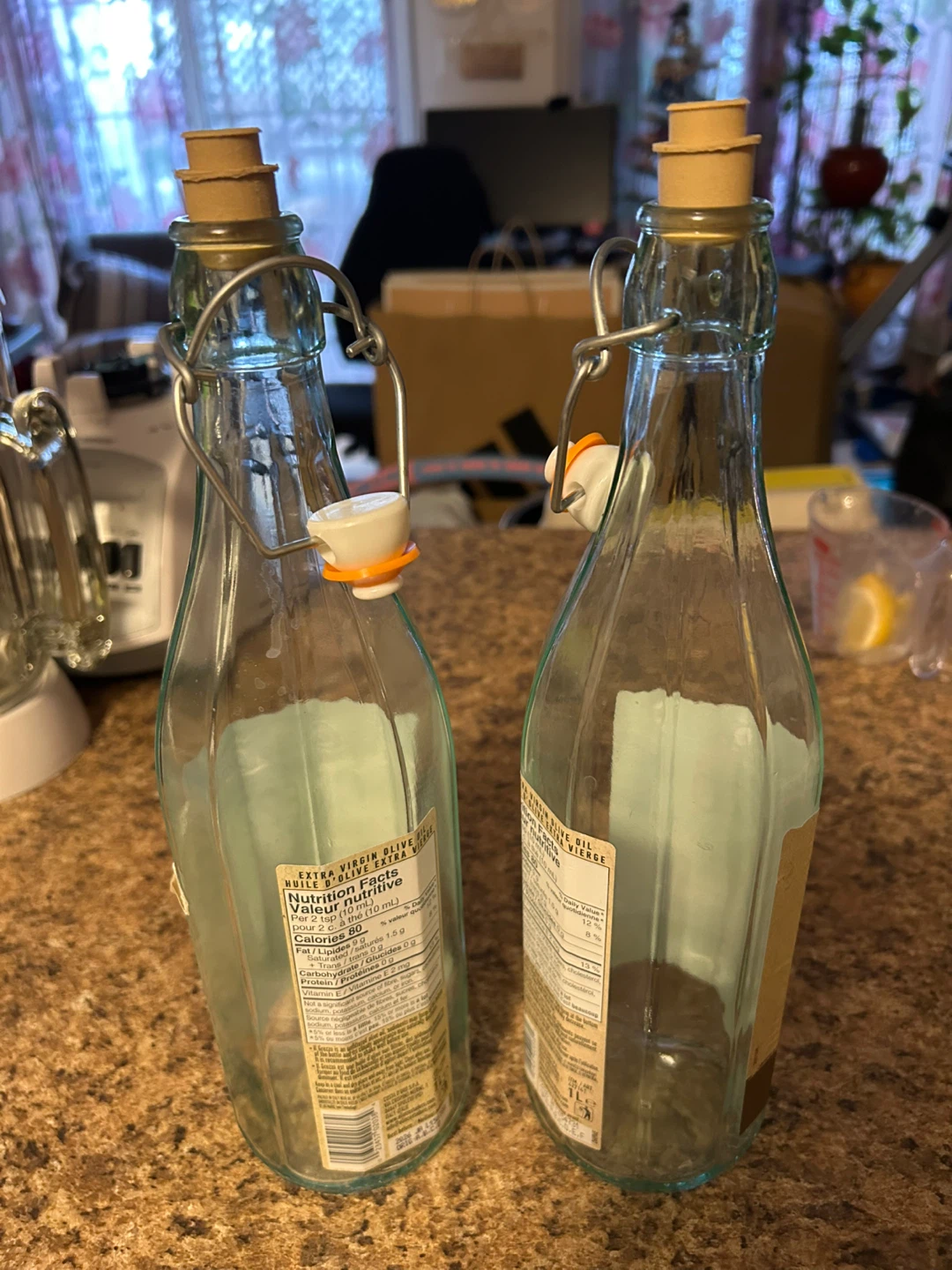 Two empty 1L glass swing-top bottles