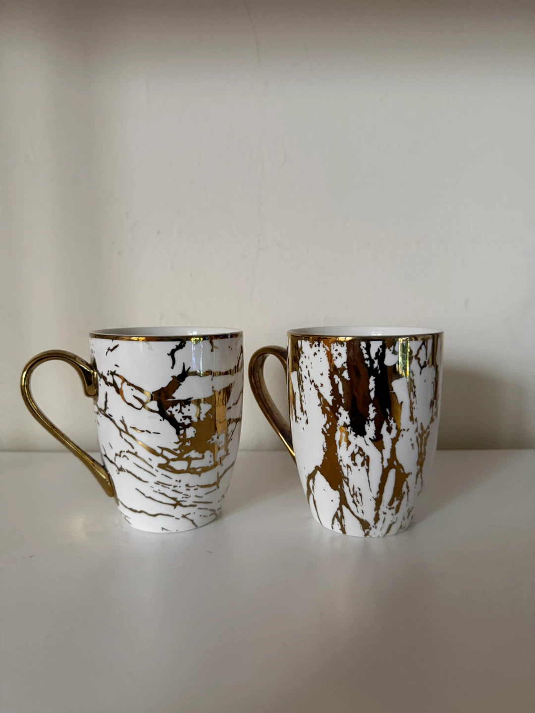 Two Certified International Marble and Gold Mugs