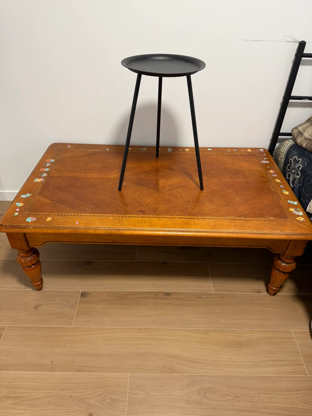 Wooden coffee table with black side table