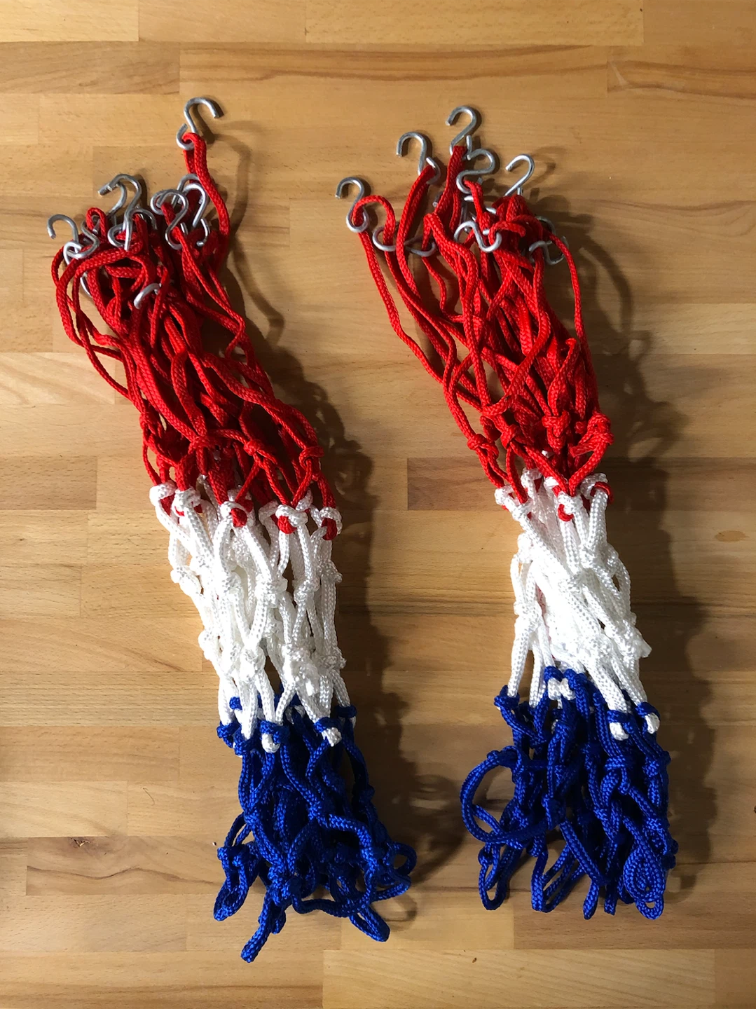 Two Red, White, and Blue Basketball Nets