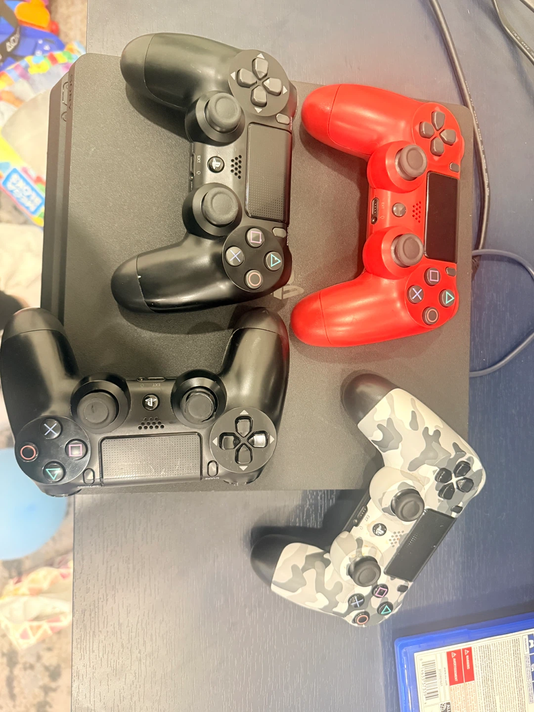 Sony PlayStation 4 Slim with 4 Controllers