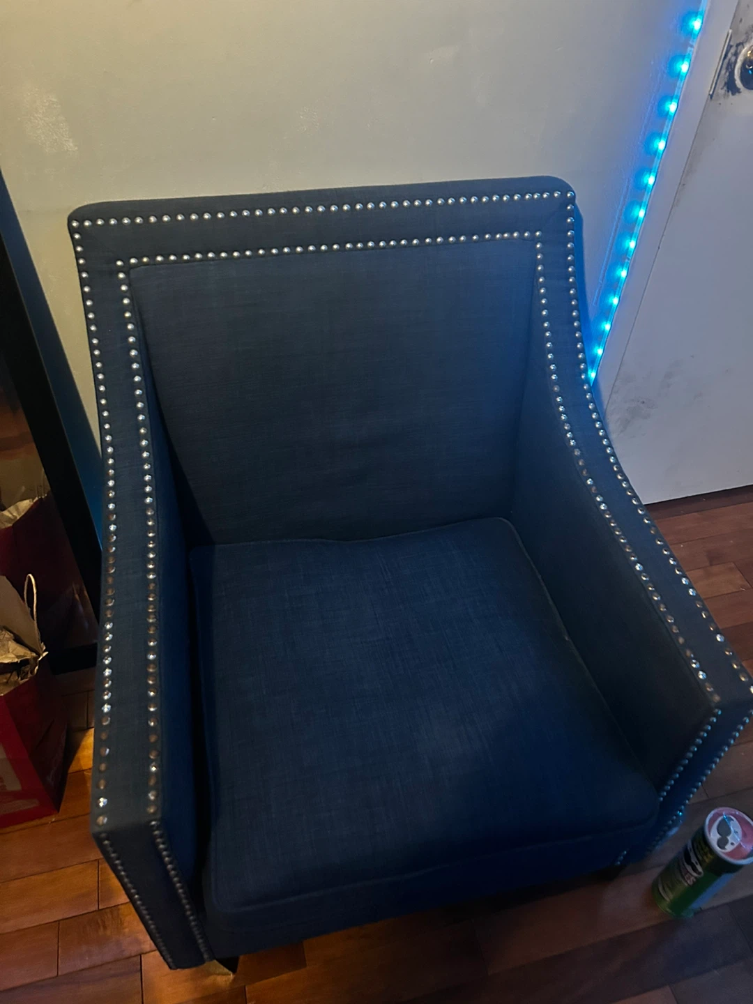 Navy blue accent chair with nailhead trim