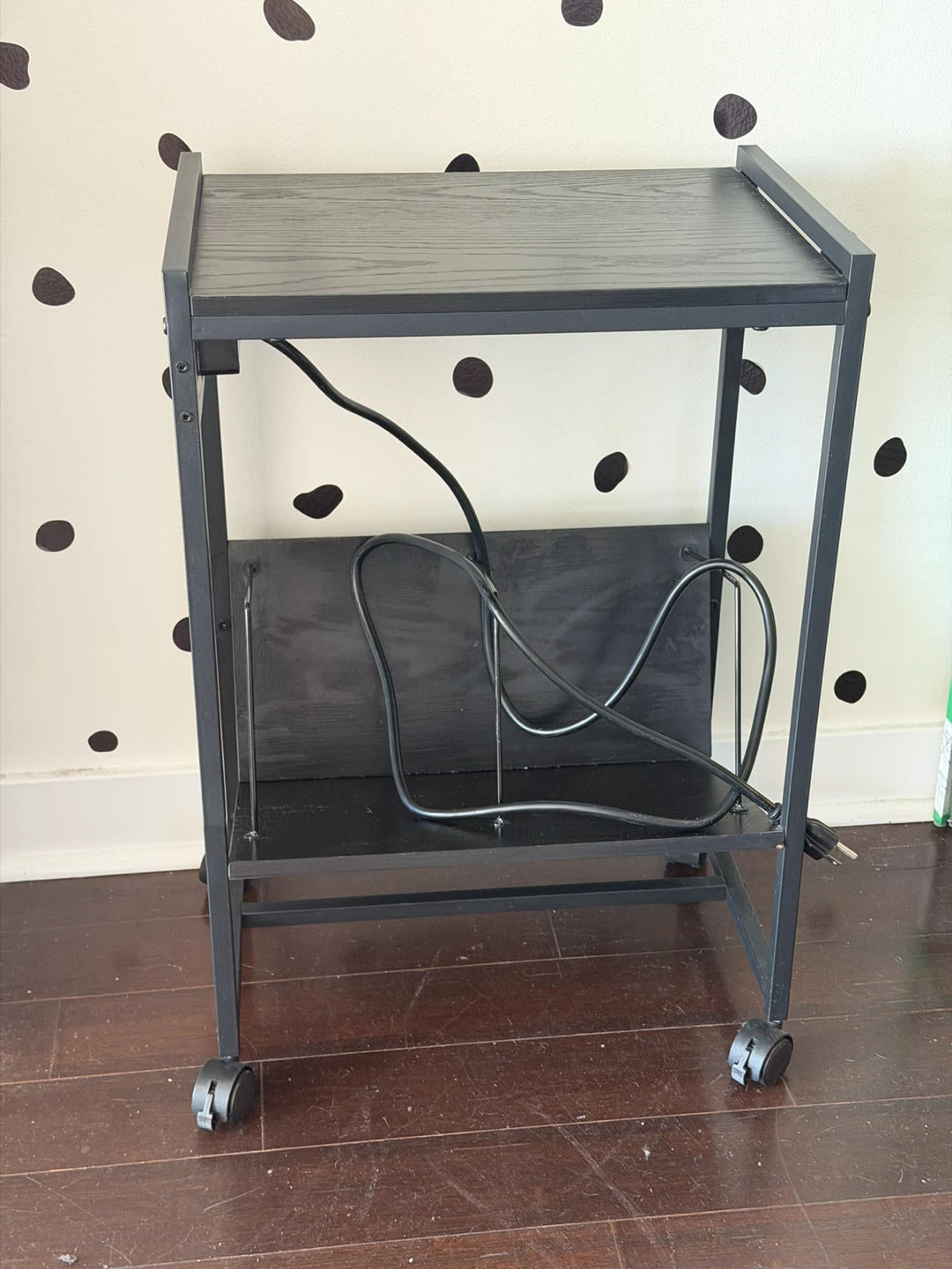 Black rolling record player stand with power outlet