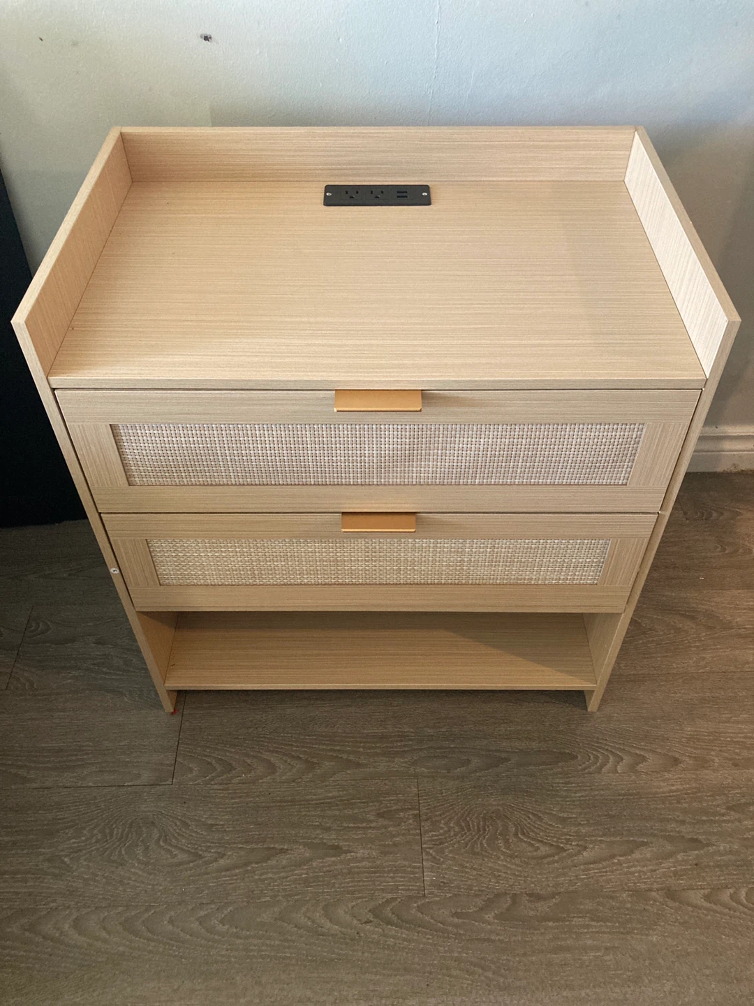 Modern bedside table with power and rattan detail
