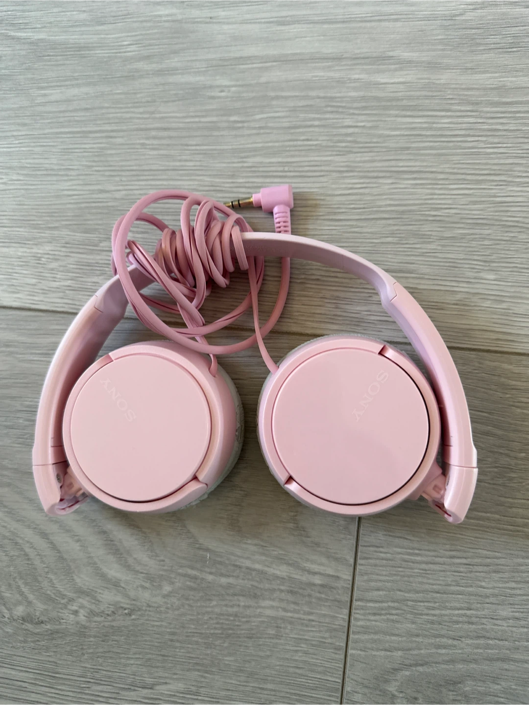 Pink Sony wired headphones