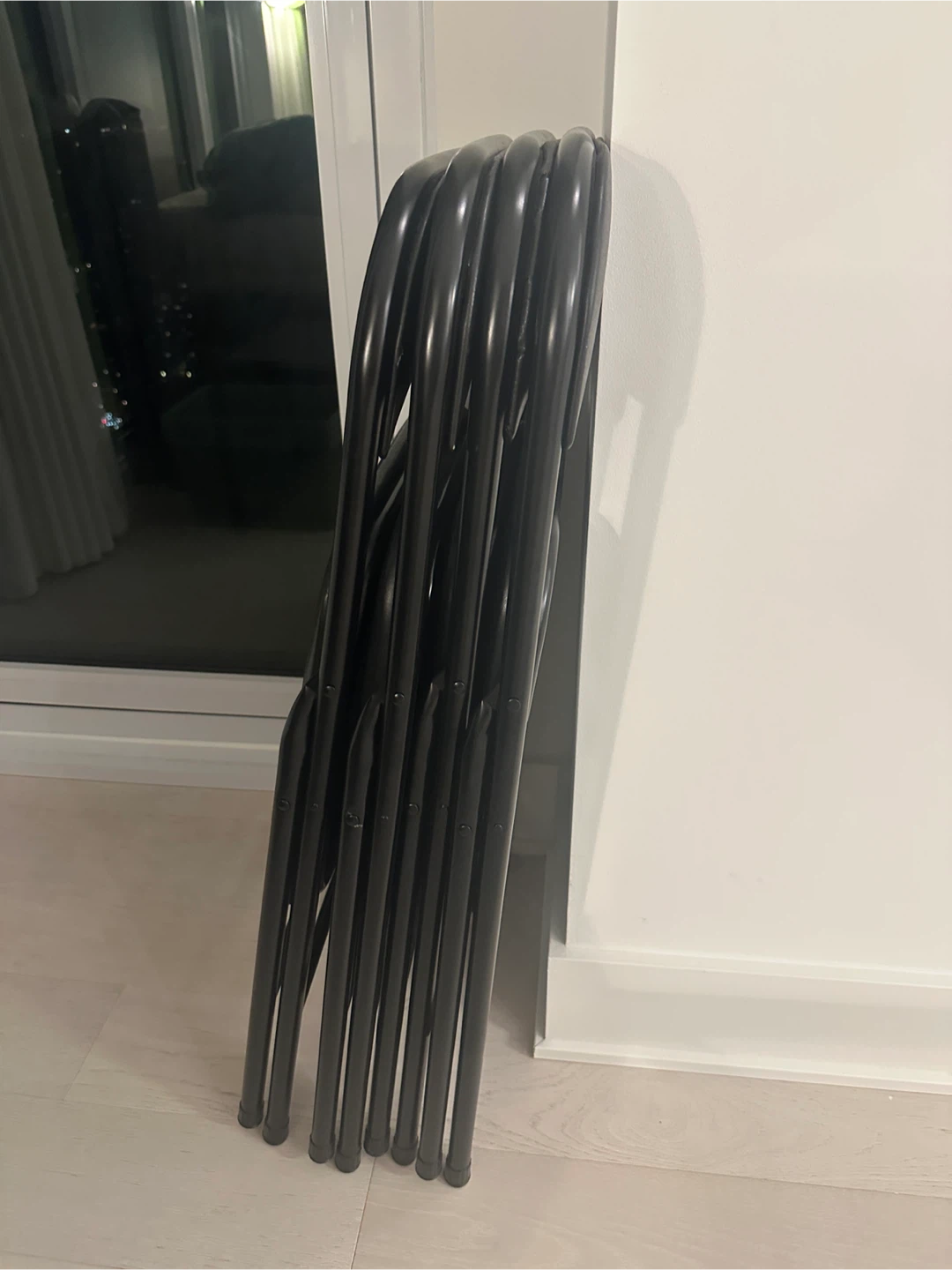 Set of 4 black folding chairs