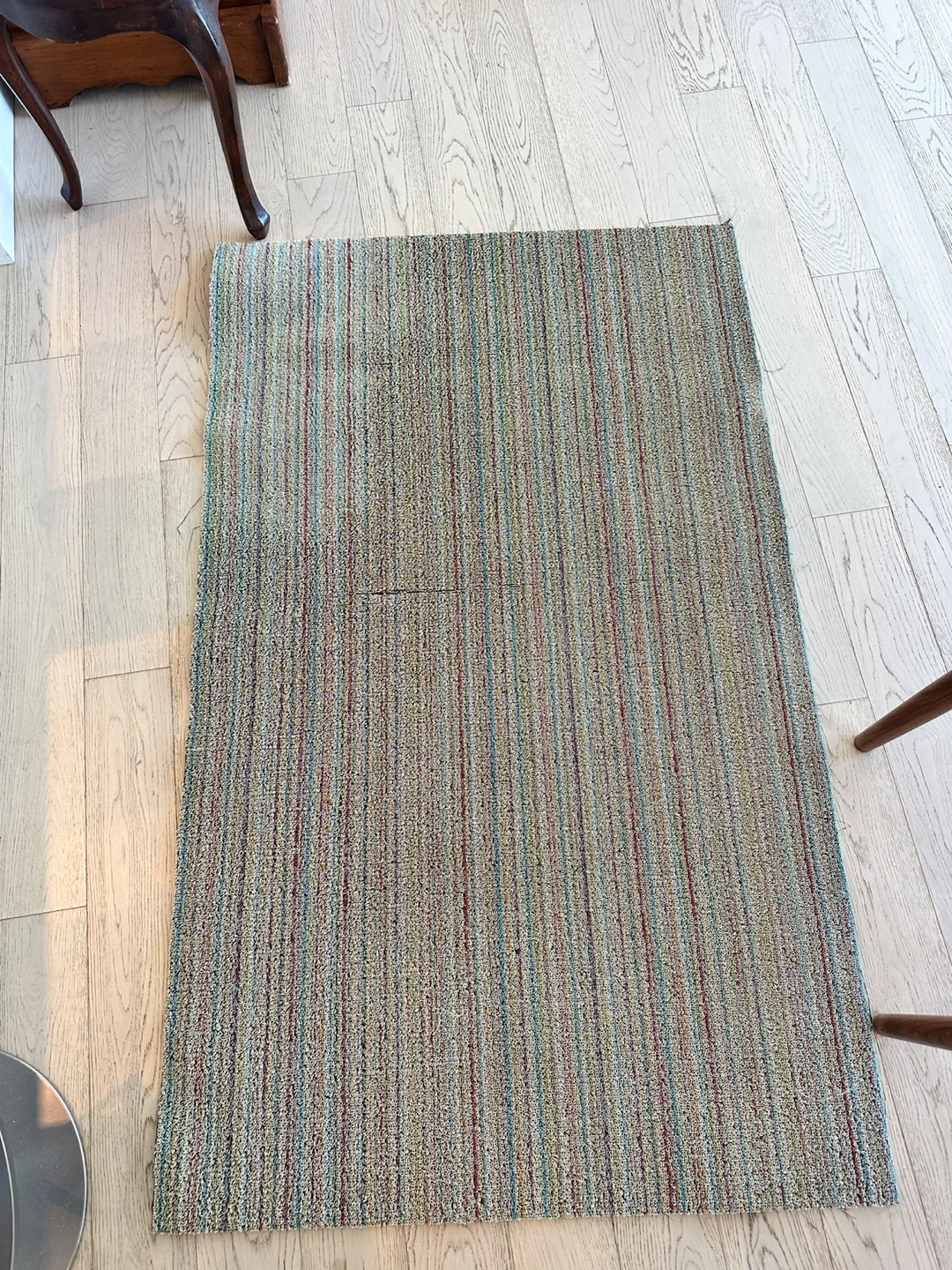 Multi-coloured striped area rug