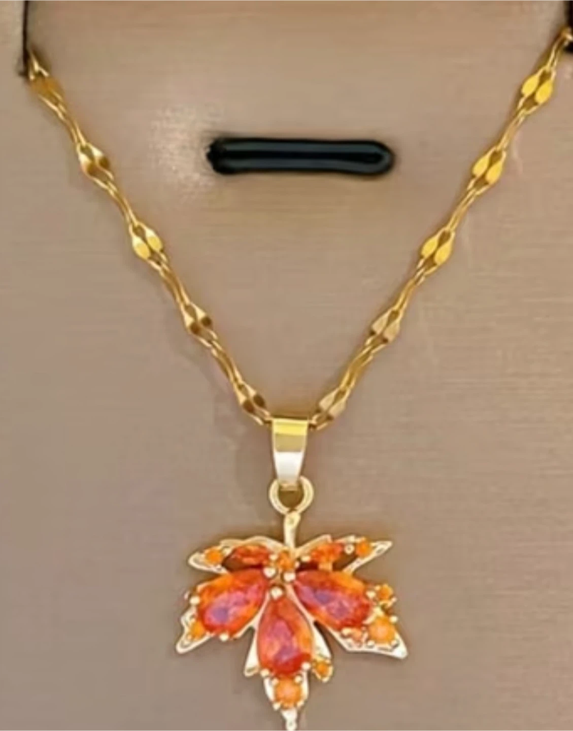 18 k gold plated maple leaf necklace with orange stones