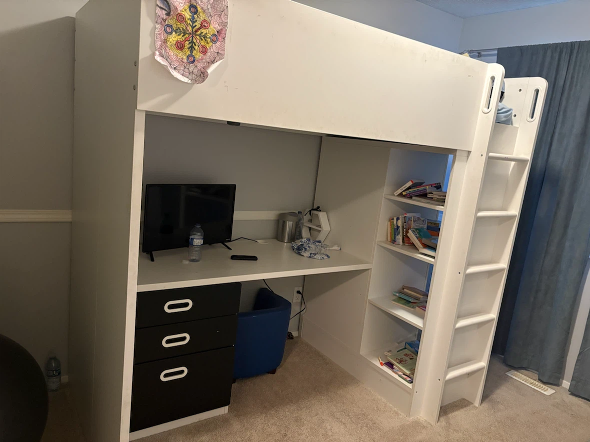 IKEA loft bed with desk, shelves and closet all in one.